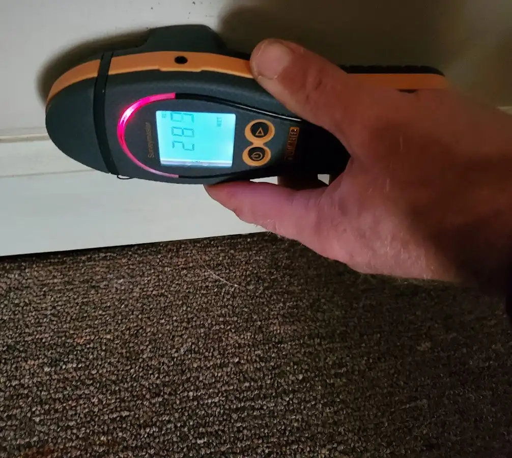 Moisture detection at baseboard during Storm Damage Restoration in Streator
